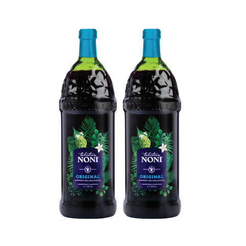 Two bottles of Tahitian Noni Original juice with fresh noni fruit and blueberries